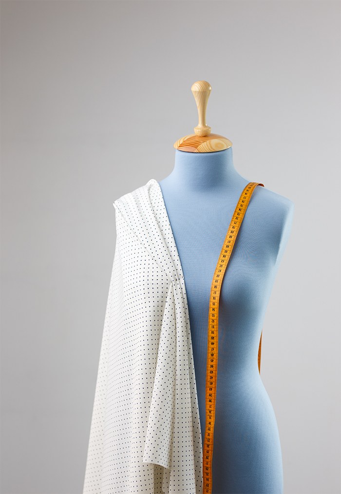 Tailor working on a garment in the atelier